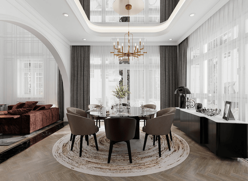 Khu vực dùng bữa đẳng cấp với bàn tròn mặt kính đen, hệ đèn chùm nến hiện đại và vách vòm cong tinh tế, kiến tạo không gian tiệc sang trọng