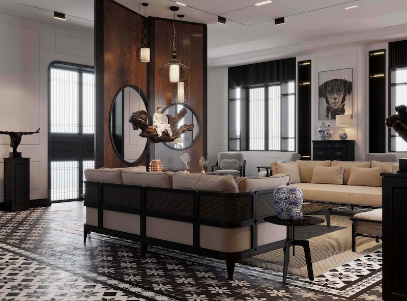 Khu vực phòng khách được tổ chức theo bố cục đối xứng, nổi bật với vách ốp gỗ tối màu kết hợp khung kim loại đen, tạo cảm giác quyền quý đặc trưng Đông Dương