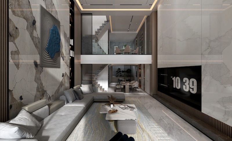 Không gian sinh hoạt thông tầng được tổ chức theo trục dọc rõ nét, nơi mảng đá lớn, ánh sáng gián tiếp và cầu thang kính cùng tạo nên vẻ hiện đại, sang trọng