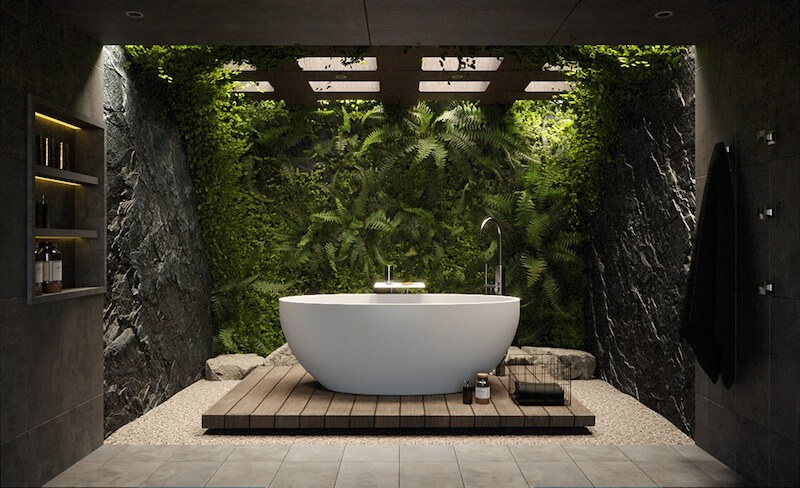 Phòng tắm nổi bật với bồn tắm độc lập, tường cây xanh và vật liệu đá tự nhiên, mang lại cảm giác thư giãn như đang hòa mình giữa rừng