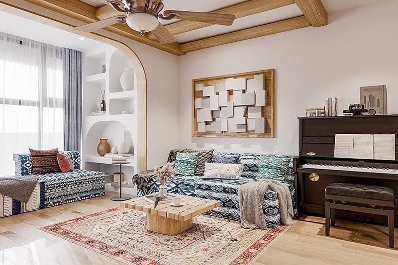 Không gian phòng khách toát lên vẻ phóng khoáng nhờ họa tiết thổ cẩm, nội thất gỗ ấm áp và những đường cong vòm nhẹ, tạo cảm giác nghệ thuật mà vẫn gần gũi