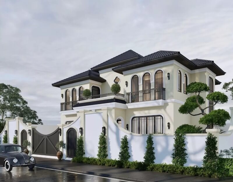 Biệt thự nổi bật với mái ngói sẫm màu, ô cửa vòm mềm mại và gam tường sáng, gợi vẻ sang trọng cổ điển hòa quyện tinh thần nhiệt đới Á Đông