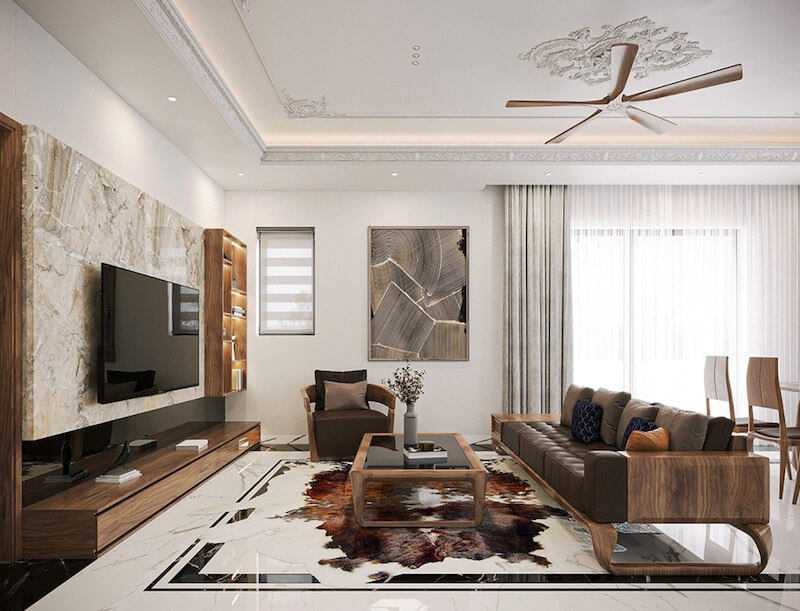 Bộ sofa gỗ dáng thấp, đệm da nâu trầm, tay vịn bo cong mềm mại gợi tinh thần Indochine hiện đại, ấm áp, hài hòa không gian phòng khách