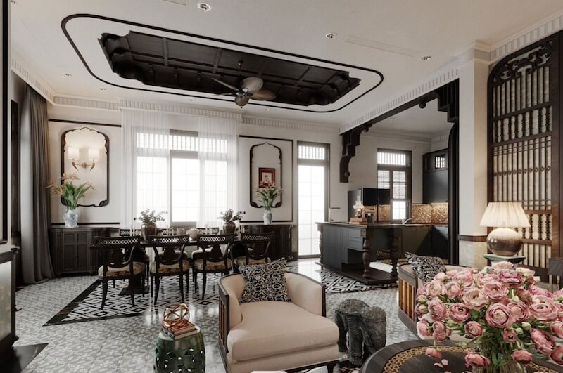 Ánh sáng vàng ấm kết hợp quạt trần cổ điển và phụ kiện gốm thủ công góp phần hoàn thiện tinh thần Indochine sang trọng, sâu lắng