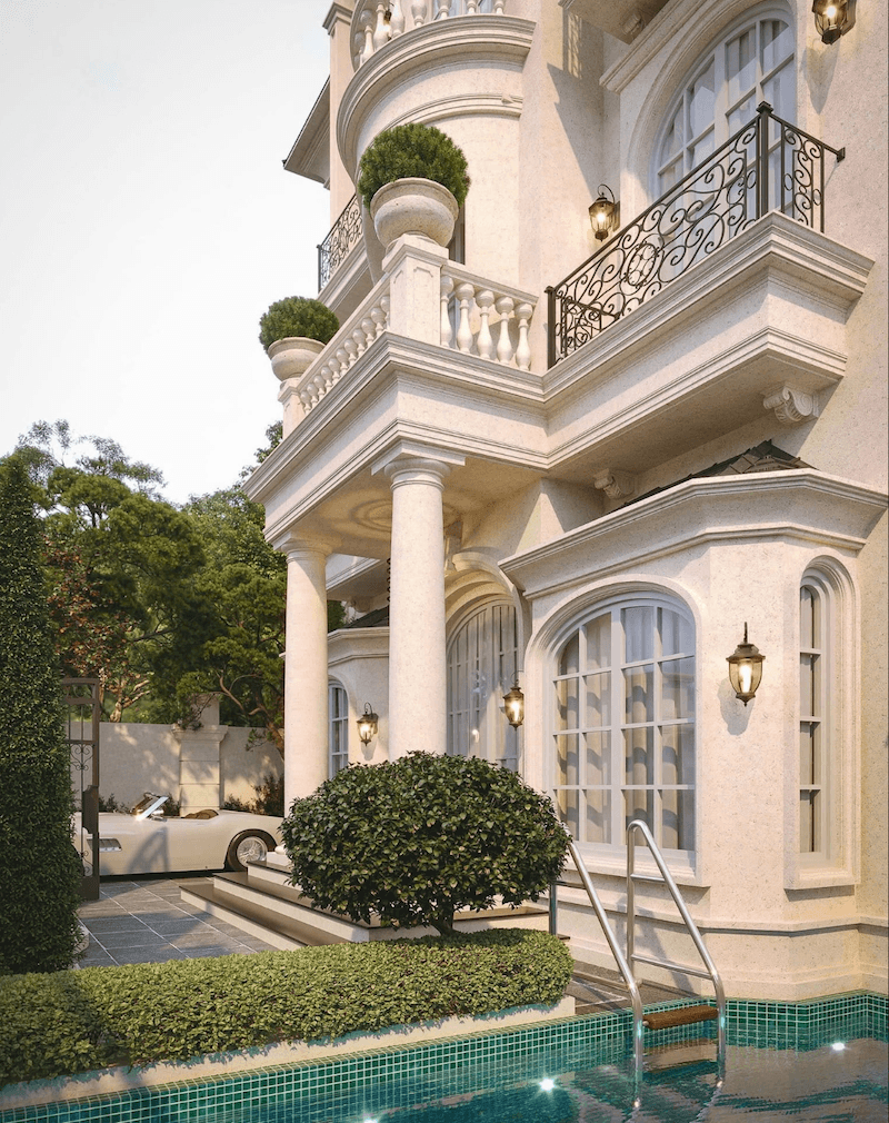 Biệt thự sân vườn Pháp cổ điển trong hình gây ấn tượng mạnh bởi hệ cột trụ tròn cao vút nâng đỡ ban công uốn cong mềm mại, tạo nên thần thái sang trọng và bề thế đặc trưng