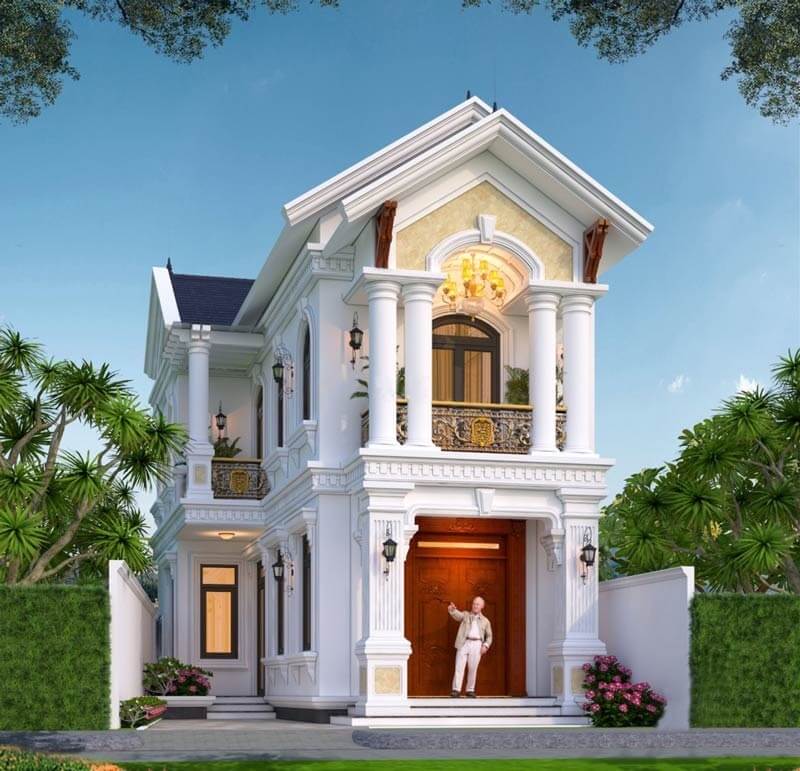 hần tam giác mái ốp màu vàng nhạt kết hợp đèn chùm ánh ấm giúp mặt tiền có chiều sâu, nổi bật vào cả ban ngày lẫn ban đêm