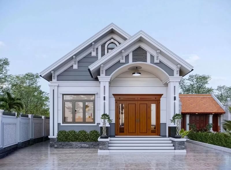 Mặt tiền tân cổ điển nhẹ gây ấn tượng với vòm sảnh cong mềm, phào chỉ tiết chế, tỷ lệ mái dốc cân đối tạo cảm giác trang nhã, bền dáng