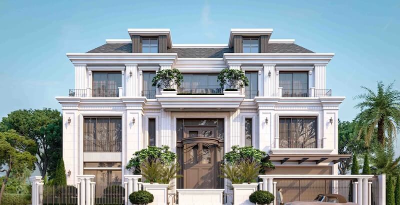 Cửa chính gỗ tự nhiên chạm khắc tinh xảo kết hợp hệ cột đối xứng và ban công rộng tạo nên trục mặt tiền bề thế, chuẩn mực tân cổ điển