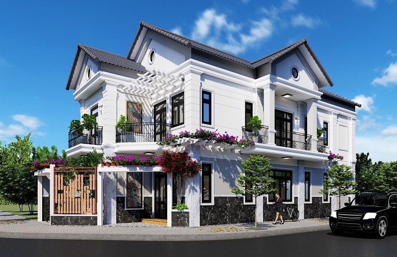 Hệ mái Thái giật cấp kết hợp lam pergola phủ hoa rực rỡ tạo nên diện mạo thanh lịch mà vẫn gần gũi, giúp căn biệt thự nổi bật giữa góc phố đầy nắng