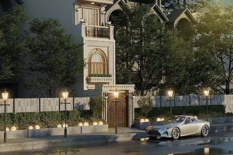 Tông màu sáng của mặt đứng được làm nổi bật dưới ánh đèn vàng ấm, giúp các chi tiết kiến trúc trở nên sâu và có chiều hơn vào ban đêm