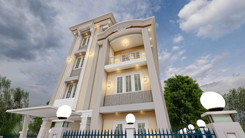 Khối ban công uốn cong nhẹ kết hợp lan can hoa văn cổ điển làm mềm hình khối, trong khi gam kem - be cùng ánh sáng vàng ấm giúp tổng thể sang trọng mà không nặng nề