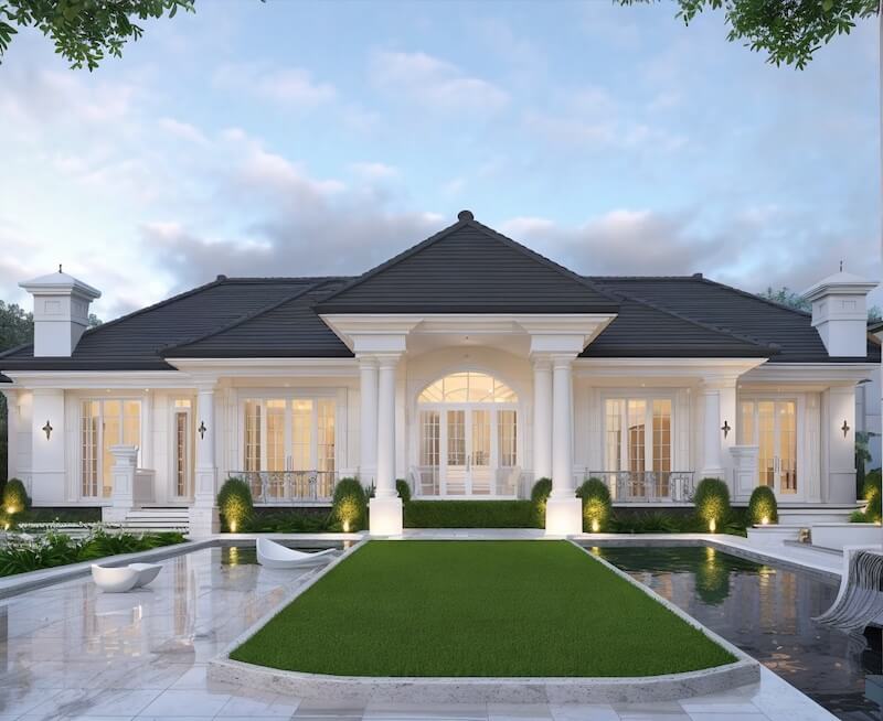 Hệ cửa kính cao sát sàn mở rộng tầm nhìn ra sân vườn, kết nối kiến trúc với cảnh quan nước và thảm cỏ phía trước, mang lại trải nghiệm sống nghỉ dưỡng đúng chất villa châu Âu