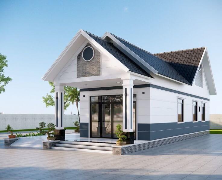 Mặt tiền nhà vườn mái Thái có cửa chính bằng kính lớn giúp đón sáng, trang trí ô thoáng tròn cách điệu và hệ bậc tam cấp rộng thoáng đón may mắn tài lộc