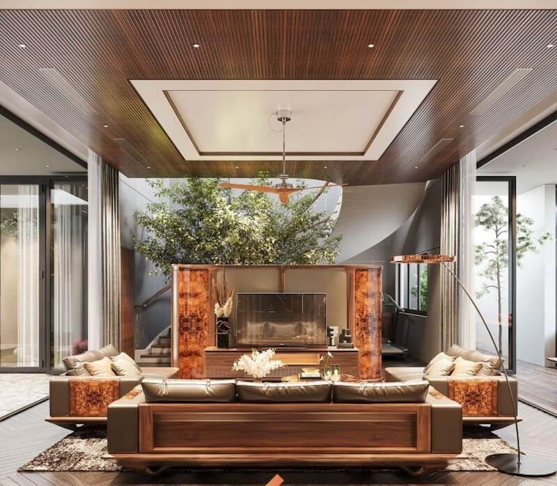 Phòng khách gây ấn tượng với vách đá onyx xuyên sáng kết hợp mảng xanh trung tâm độc đáo, tạo điểm nhấn sang trọng và kết nối thiên nhiên hài hòa