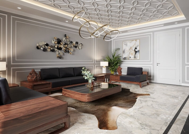 Thiết kế toát lên vẻ hiện đại nhờ bộ sofa gỗ óc chó tối giản kết hợp trần hoa văn 3D tinh xảo và đèn thả uốn lượn đầy nghệ thuật