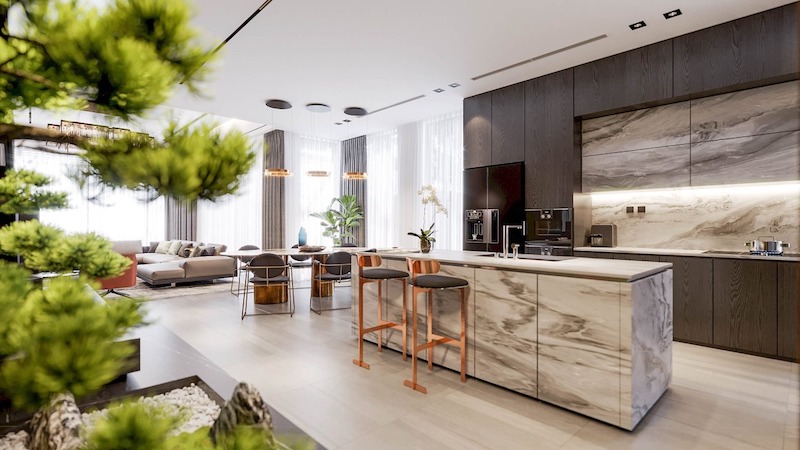 Không gian bếp - phòng khách mở rộng với đảo bếp đá vân mây nổi bật, kết hợp cửa kính lớn đón sáng và mảng xanh trang trí tạo cảm giác hiện đại, gần gũi thiên nhiên