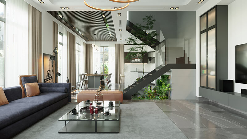 Thiết kế nổi bật với khoảng thông tầng kết hợp tiểu cảnh xanh dưới cầu thang, mang thiên nhiên len lỏi vào không gian hiện đại, tạo chiều sâu và sự thư giãn