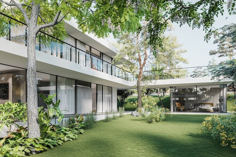 Mảng kính full-height và ban công xuyên suốt, giúp kiến trúc hòa tan vào cảnh quan, tạo cảm giác sống giữa khu vườn thay vì chỉ nhìn ngắm từ bên trong