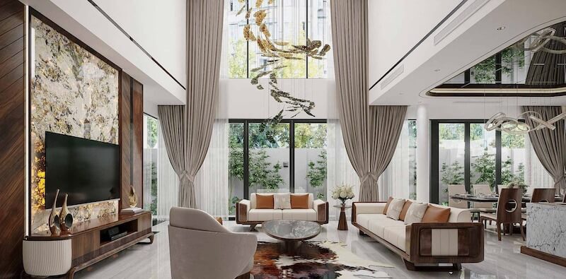 Trần cao thông tầng và mảng đá marble vân nghệ thuật phía sau kệ TV, kết hợp nội thất gỗ óc chó bo cong tinh tế tạo cảm giác sang trọng, thoáng đãng và đầy khí chất thượng lưu