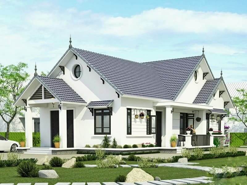 Các chi tiết cửa sổ vòm, hiên nhỏ và lối dạo đá giữa sân vườn giúp tổng thể trở nên duyên dáng, gần gũi với không gian xanh xung quanh