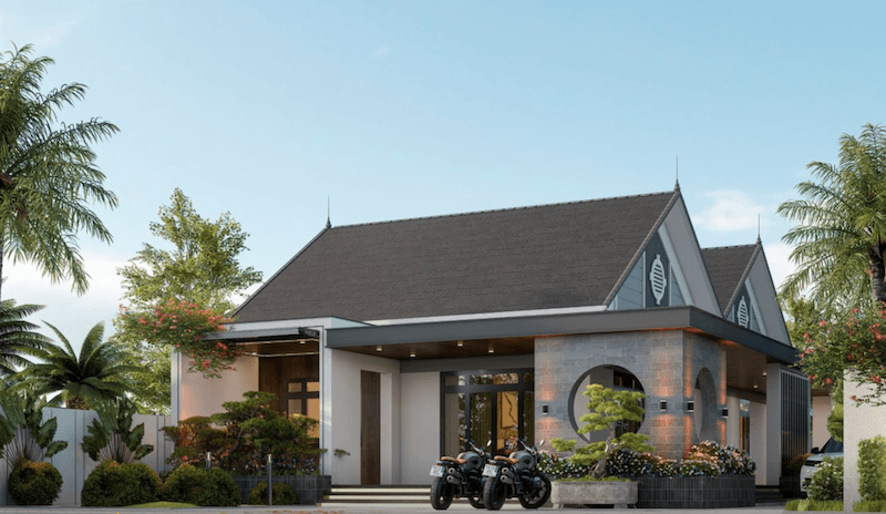 Các mảng tường ốp đá, cửa kính lớn và hệ đèn âm trần ở hiên giúp mặt tiền trở nên ấm cúng, đồng thời hòa hợp với khu vườn xanh bao quanh