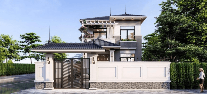 Không gian bên trong thoáng đãng với ban công trồng hoa, cửa kính lớn đón sáng tự nhiên và nhiều mảng xanh bao quanh, mang lại cảm giác gần gũi, thư giãn cho gia đình