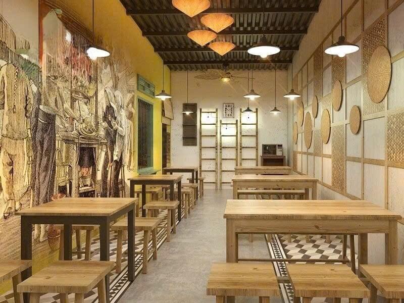 Tranh tường kể chuyện Huế tạo điểm nhấn thị giác, kết hợp mảng tre mây trang trí bên phải