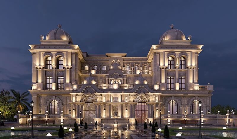 Lâu đài nổi bật với bố cục đăng đối, khối trung tâm uy nghi, mái vòm cân xứng hai bên, ánh sáng vàng hoàng gia tôn vinh đá tự nhiên và phù điêu cổ điển. 