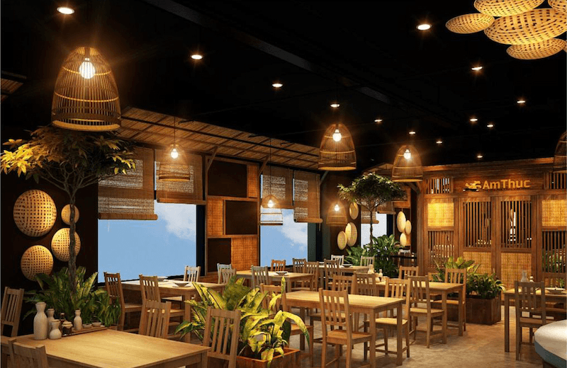 Ánh sáng vàng ấm kết hợp vật liệu tự nhiên tạo nên bầu không khí ấm cúng, gần gũi, phù hợp với mô hình ẩm thực sông nước
