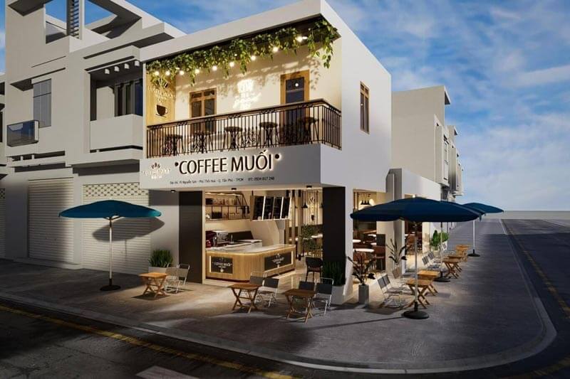Việc bố trí không gian mở hai tầng kết hợp mảng xanh rủ xuống từ ban công tạo nên một điểm dừng chân thoáng đãng và cực kỳ bắt mắt